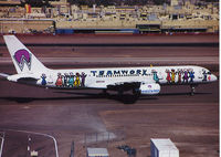 N902AW @ KPHX - Teamwork taxiing to the gate. Scanned from a print. - by John Meneely
