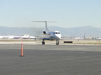 N581MB @ ONT - Turning off of taxiway Sierra and entering Atlantic Aviation area - by Helicopterfriend