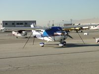 N5323H @ CNO - Tied down, covered and parked in the northside parking area - by Helicopterfriend