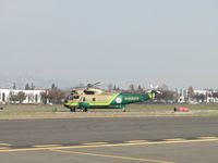 N950DG @ POC - Entering runway 26L from Taxiway Cocco - by Helicopterfriend