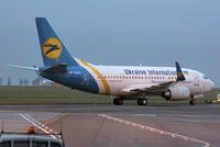 UR-GAS @ EGSH - Being towed to Air Livery for spray after the sun had set.