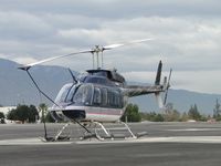 N6133C @ CCB - Tied down and parked north of a hanger on the helipad at the east side - by Helicopterfriend