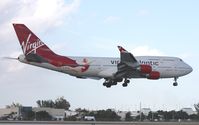 G-VFAB @ MIA - This is a bird I been wanting to get, hoping it would divert some time up to MCO or sub.  This is the only Virgin 747 with the girl painted by the tail- unfortunately a stupid cloud had to ruin the shot too. - by Florida Metal