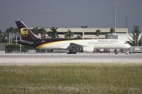 N451UP @ MIA - UPS 757 taxiing to depart on 26R, the first signs that the wind had shifted. - by Florida Metal