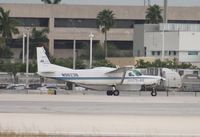 N9623B @ MIA - Cessna 208B departing on Runway 8L - by Florida Metal
