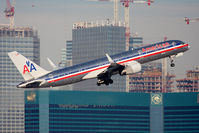 N650AA @ LAS - American Airlines N650AA (FLT AAL1554) climbing out from RWY 1R en route to Dallas/Fort Worth Int'l (KDFW). Alot of new construction is occurring along the Las Vegas Strip. - by Dean Heald