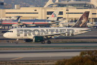 N928FR @ LAX - Frontier Airlines Hank the Bobcat N928FR (FLT FFT775) from Kansas City Int'l (KMCI) on the high-speed taxiway after landing on RWY 25L. - by Dean Heald