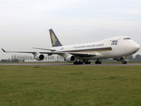 9V-SFH @ EHAM - Taxi to the Cargo gate off Schiphol Airport - by Willem Goebel