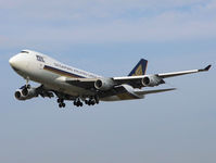 9V-SFP @ EHAM - Landing on runway C18 of Amsterdam Airport - by Willem Goebel