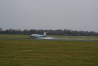 PH-PRM @ EHGG - The slippy blue piper, which was just departing on runway 23, nosed out a bit lately that the runway was pretty wet. This caused some puddles of water in the air. - by Jorrit de Bruin