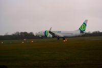 PH-HSD @ EHGG - The TRA798 from Innsbruck tried to make a soft landing due to the wetty runway, but bounced back in the sky.