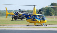 N123YW @ KDAN - This 2005 Robinson R44 11 landed then five U.S. ARMY  Loach which were nearby lined up behind on the main runway preparing for their very awesome takeoff. - by Richard T Davis