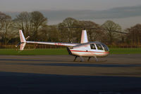 G-KELI @ EIWT - R.44 Parked on the ramp at Weston - by Noel Kearney