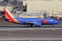N647SW @ PHX - Southwest Airlines Triple Crown ONE N647SW (FLT SWA605) rolling out after arrival from Lambert-St Louis Int'l (KSTL).