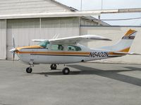 N6402N @ CNO - Parked near a hanger - by Helicopterfriend
