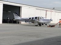 N174TA @ CNO - Using a small tug to push the ship into the hanger - by Helicopterfriend