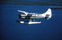 C-FAZW - AZW over Wollaston Lake, SK, in the early 1980 aprox. (poor slide scan!) - by Darrel Giesbrecht (Luke)
