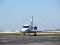 N890QS @ BKL - N890QS, seen pulling off of BKL's Runway 6L. - by aeroplanepics0112