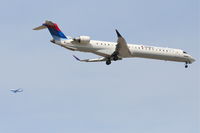 N805SK @ KORD - SkyWest/Delta Connection CRJ-900, N805SK RWY 10 approach KORD with a UAL 747 on downwind. - by Mark Kalfas