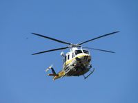 N110LA @ POC - Copter 11 inbound following taxiway Sierra to LA County Air Ops helipad area - by Helicopterfriend