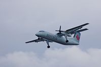 C-GEWQ @ YVR - Landing on a dreary Feb. day Now operating as Air Canada Express.