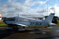 OY-BLB @ EKRK - This Piper Warrior has the same owner as the tent behind it. Parked at Roskilde airport.
