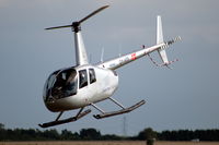 OY-HTF @ EKRK - Robinson R44 II flying at Roskilde airport, Denmark. - by Henk van Capelle