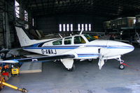 G-AWAJ @ EGNH - inside the Blackpool Air Centre hangar - by Chris Hall