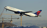 N130DL @ KLAX - Departing LAX on 25R - by Todd Royer