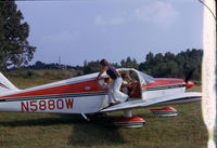 N5880W - My brother in left seat, my wife exiting plane. - by Jim Warren