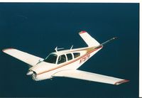 N7917R - I owned this sweet turbo Bonanza from 2000 to 2006. This photo taken over Lake Tahoe 9-15-2002. - by Mike Hoffman