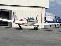 N6554K @ CNO - Parked by a hanger - by Helicopterfriend