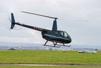 G-FCUM @ EGGP - Post flight en-route back to General Aviation via taxiway A1. - by Mark J Kopczewski