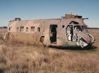 A15-001 - Photograph by Edwin van Opstal with permission. Scanned from a color print. RAAF's first Chinook. Crashed into a dam in 1985. Was recovered and used as a fire training aid at Amberley. - by red750