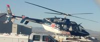 N505MT @ KTUS - MedTrans Bell 407 taking off from MedTrans hangar at KTUS.  Pilot James Campbell at the controls. - by Ehud Gavron