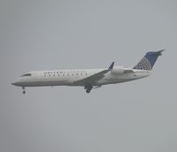 N937SW @ ONT - Almost out of the low clouds - by Helicopterfriend