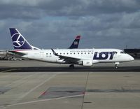 SP-LDE @ LFPG - The aircraft has been displaying the new livery since November 2011.