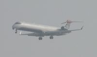 N931LR @ ONT - On half mile final for 26R, coming out of the low clouds - by Helicopterfriend