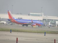 N392SW @ ONT - Just landed on 26R and is taxing back to terminal - by Helicopterfriend
