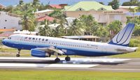 N407UA @ TNCM - N407UA