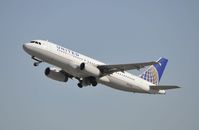 N425UA @ KLAX - Departing LAX on 25R - by Todd Royer