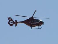 N36RX @ CCB - Hovering south of the airport waiting for plane to clear taxiway - by Helicopterfriend