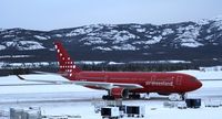 OY-GRN @ CYXY - On the ramp to pick up Greenland's athletes from the Arctic Winter Games. - by Murray Lundberg