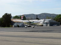 N562AT @ SZP - 1974 Cessna 182P SKYLANE, Continental O-470-S 230 Hp, takeoff climb Rwy 22 - by Doug Robertson