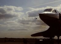 G-BOAC @ EGDY - BA Concorde aircraft G-BOAC flying over BA Concorde G-BOAA during the 1986 RNAS Yeovilton Air Day. - by Roger Winser