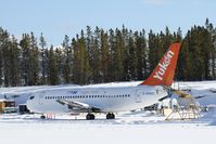 C-GNAU @ CYXY - Being stripped down behind the Air North shops. - by Murray Lundberg