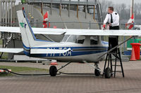 PH-TGA @ EHTE - He's wondering why it's taking so long to refuel. Take a look under the plane and see why.