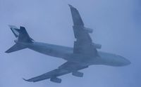 B-HOX @ EGLL - In and out of the clouds - Departing Heathrow for Hong Kong as flight number; CX252- Photo taken from my back garden