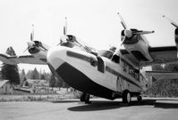 N150M @ OG29 - N150M, McKinnon G-21D s/n 1251, in 1965 with four 340 hp Lycoming GSO-480-B2D6 supercharged piston engines just prior to its conversion to two 550 shp PT6A-20 turbine engines. - by Gary L. Killion