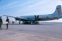 131577 - Members of Inshore Undersea Warfare Group 1 WestPacDet Unit 2 loading aircraft at Naval Air Station, Los Alamitos, Calif. as they deploy to Vietnam in December 1966. - by Unknown